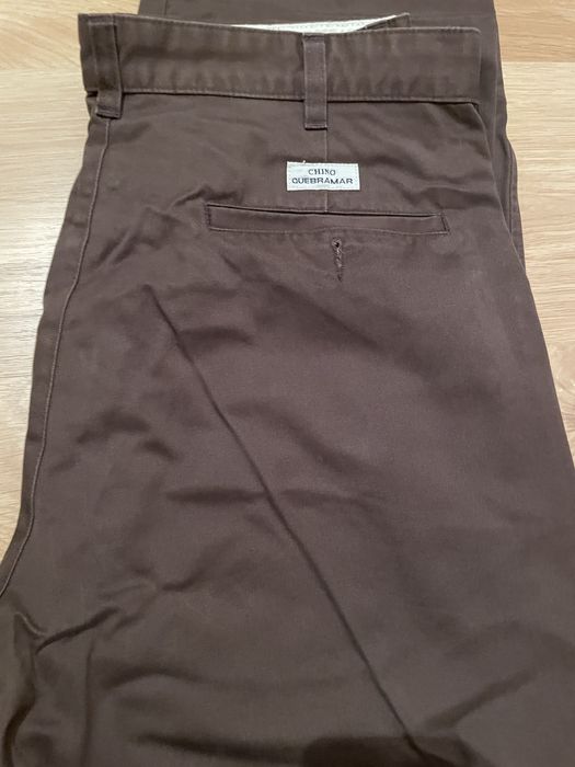 Calças castanhas quebramar