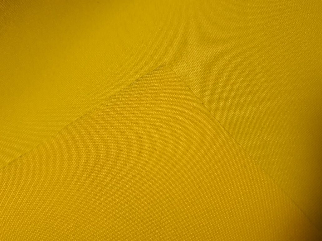 Tkanina poliester żółta szer.ok.100-105 cm.