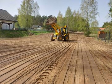 Uslaugi koparką. Koparko ładowarką. Roboty ziemne.