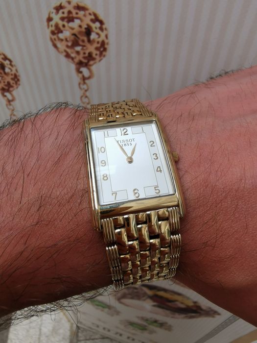 Новий золотий годинник Tissot