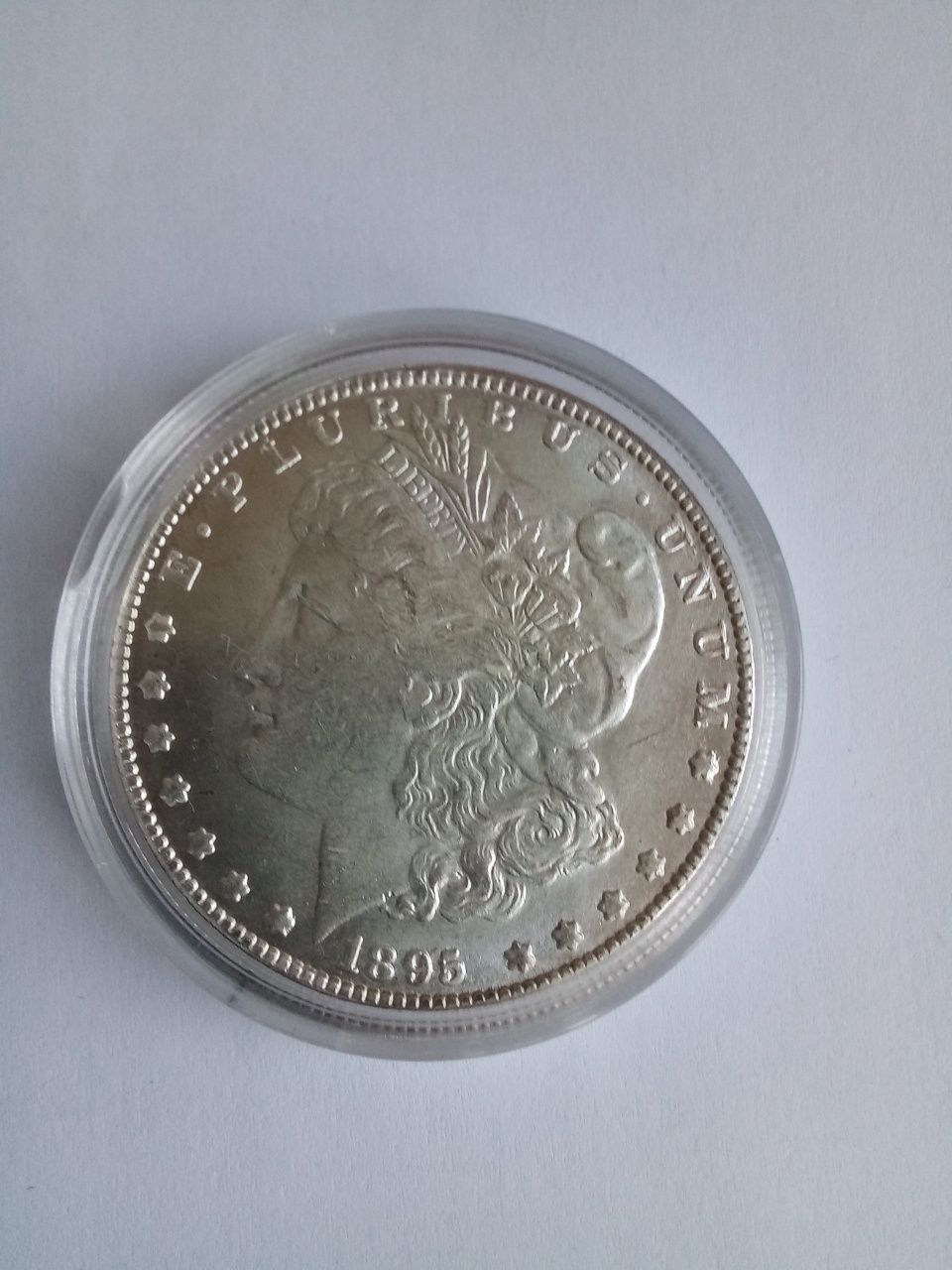 Срібний долар 1895 року.