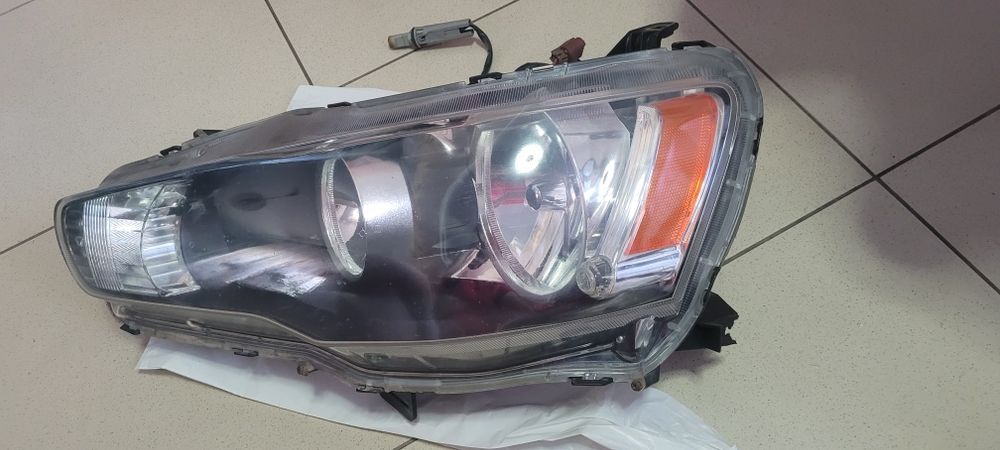 Фара передня ліва оригінал Lancer 2008 8301B259