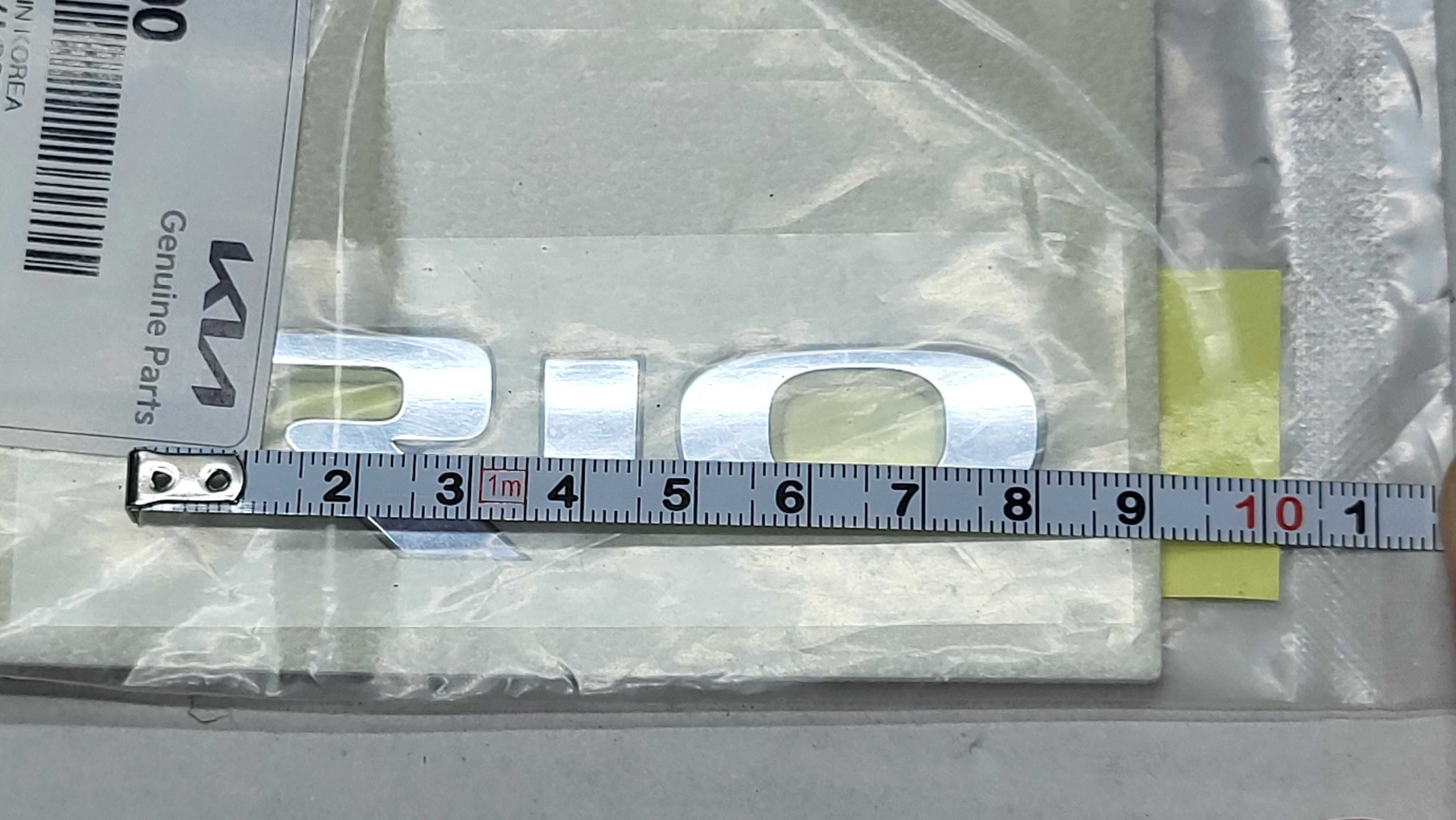 Emblemat Znaczek Napis modelu Kia RIO III IV 2011- OE 86310-1W000 NOWY