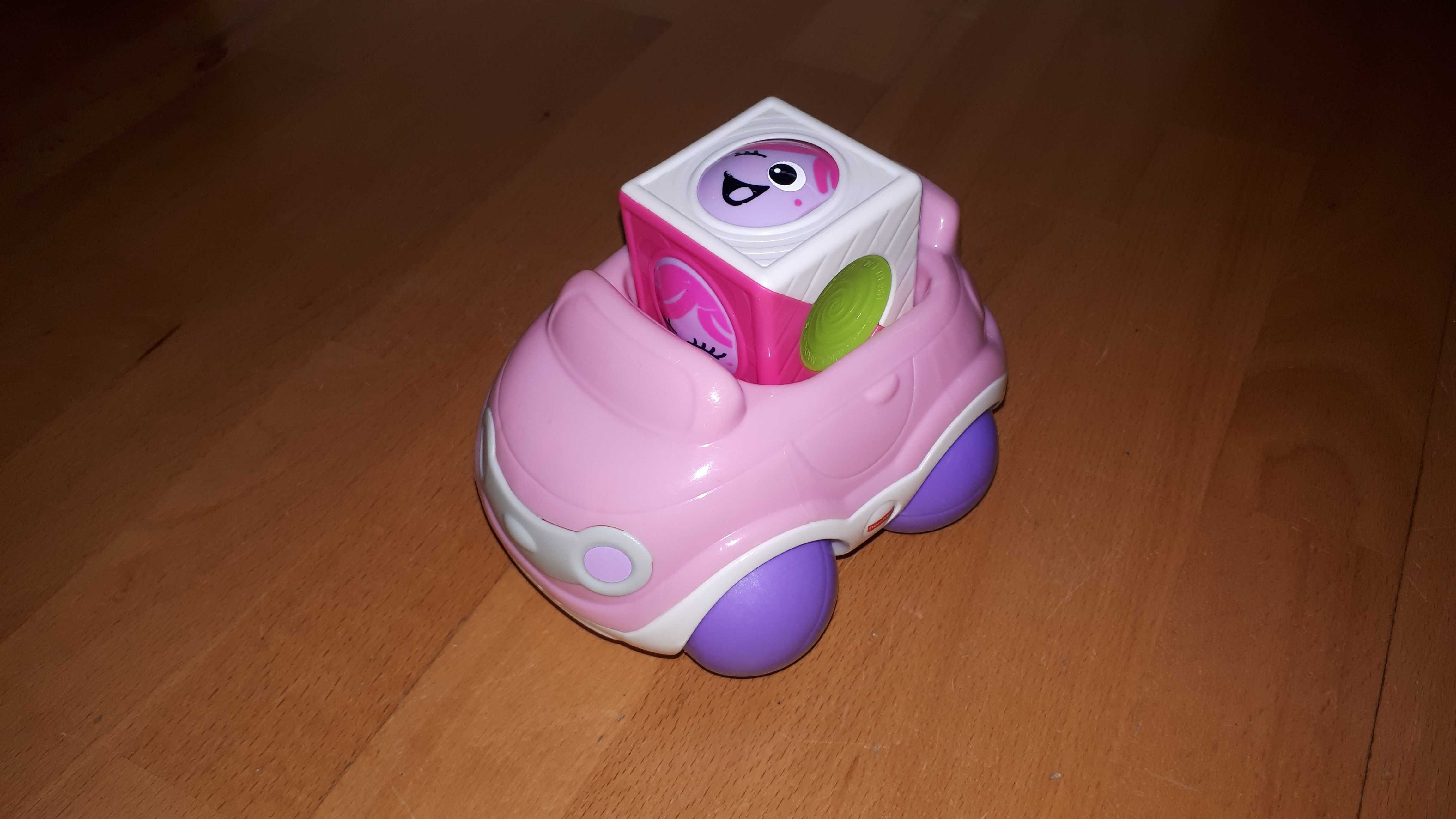 Różowe autko firmy Fisher-price