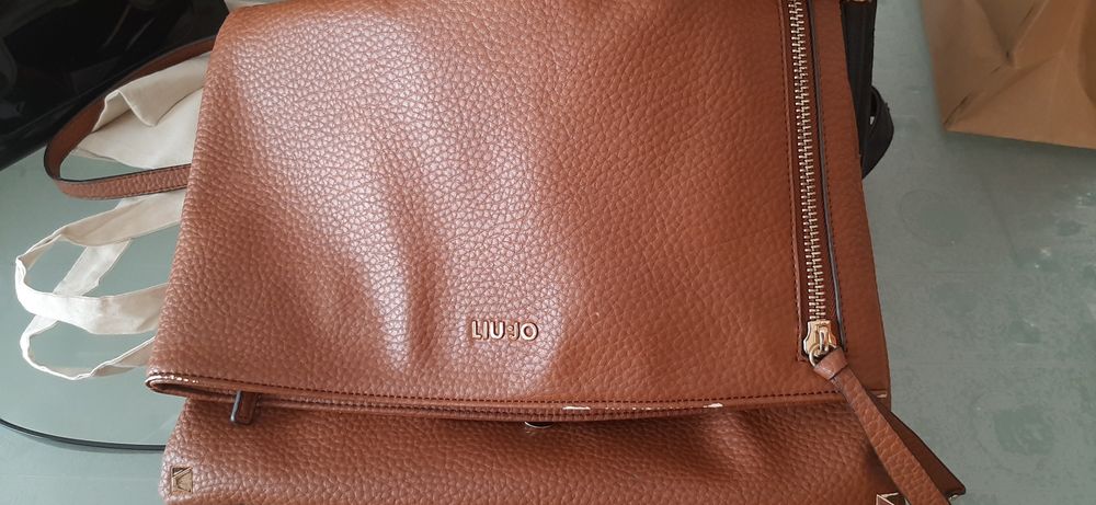 Carteiras e mochilas de marca original