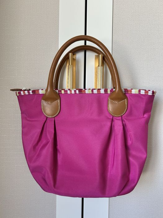 Mala de mão fúcsia