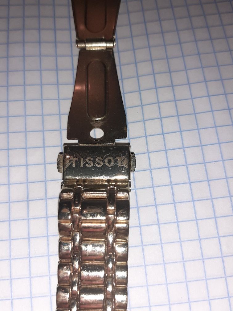 Электронные часы Tissot.