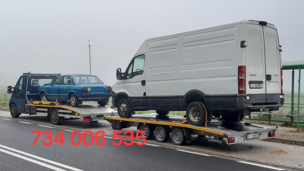 Pomoc drogowa autolaweta transport aut łodzi maszyn rolniczych