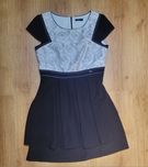 Elegancka czarna sukienka z białą górą
