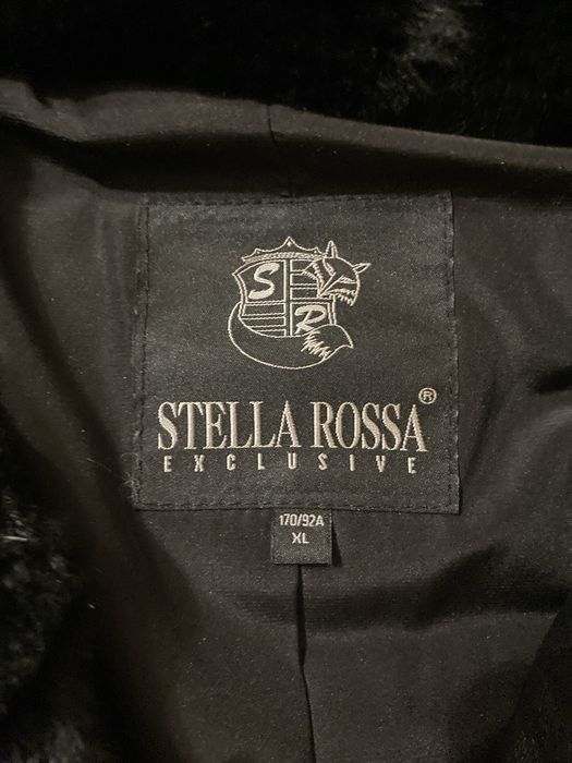 Жіноча шкіряна куртка на пух/перо,чорна,з капюшоном утеплений мутоном.