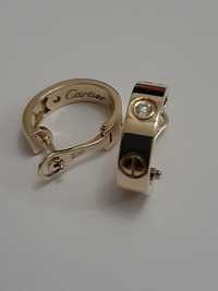 Золотые серьги с бриллиантами Cartier.