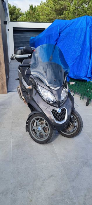 mp3 500. apenas 23817kms com revisao. de garagem estimada. CARTA B