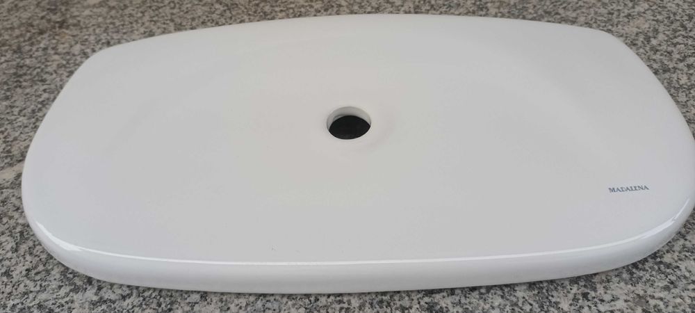 Tampa de autocolismo em louça