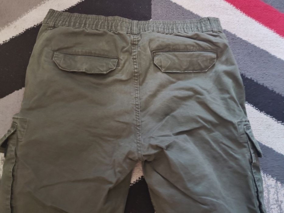 Spodnie męskie młodzieżowe zielone khaki bojówki Cropp rozmiar 34L