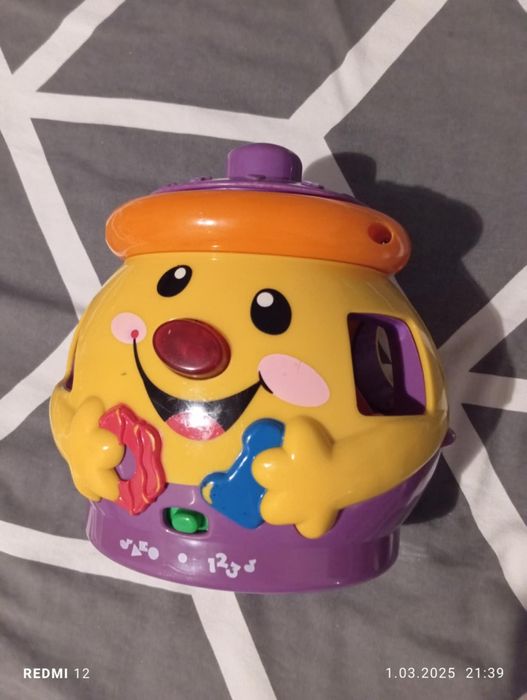 Garnuszek na klocuszek Fisher Price