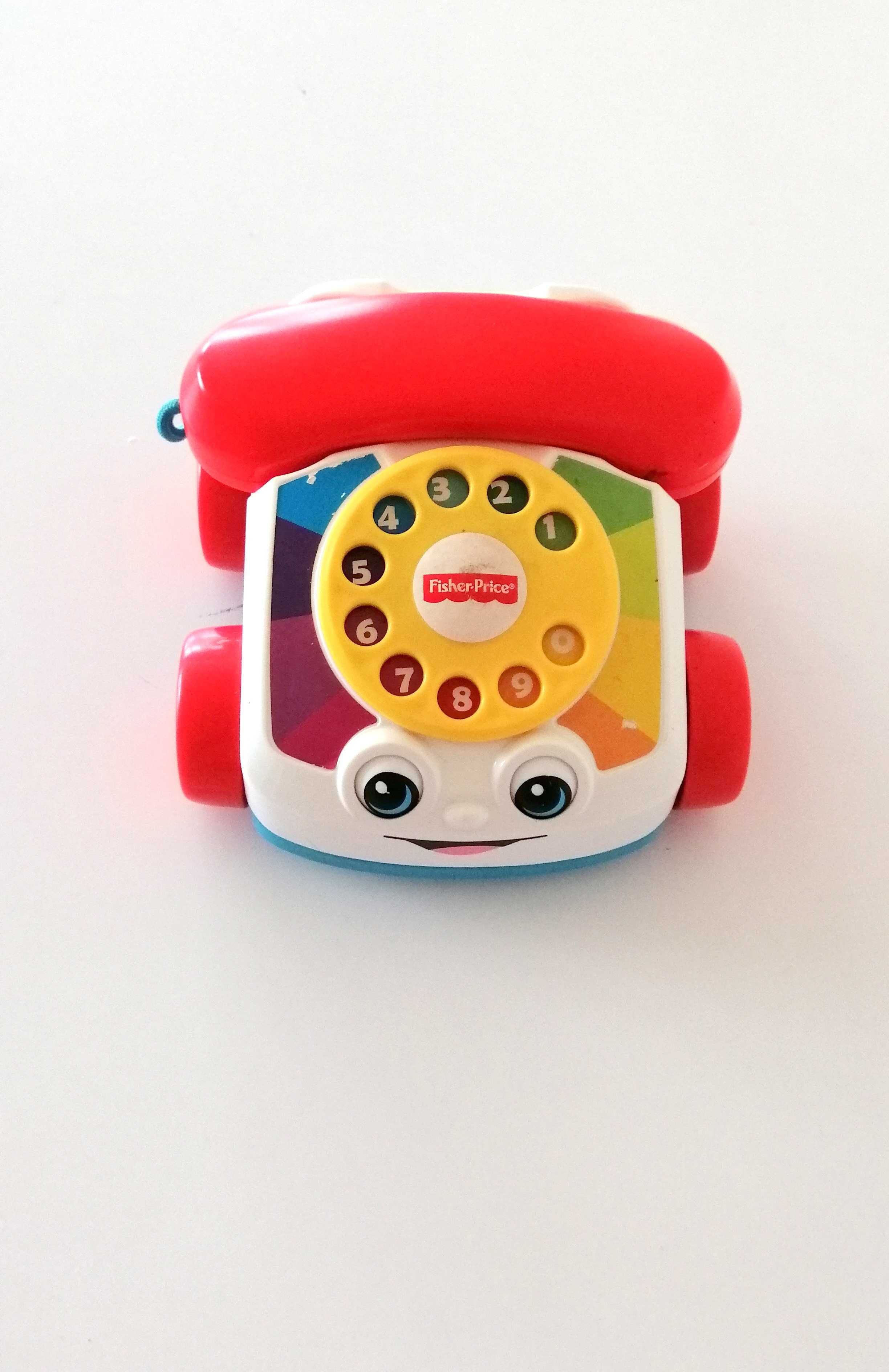 telefonik samochodzik fisher-price ze słuchawką pojazd na korbkę