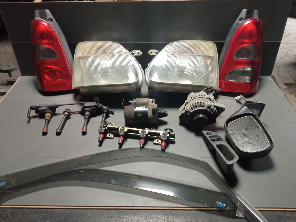 Suzuki Wagon R+ 1.3 alternator rozrusznik lampy cewki  listwa lusterko