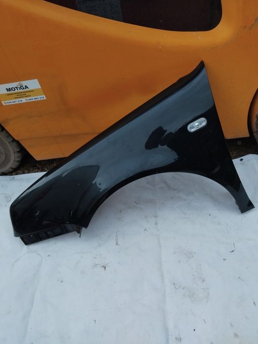 Blotnik lewy przód VW Golf 4