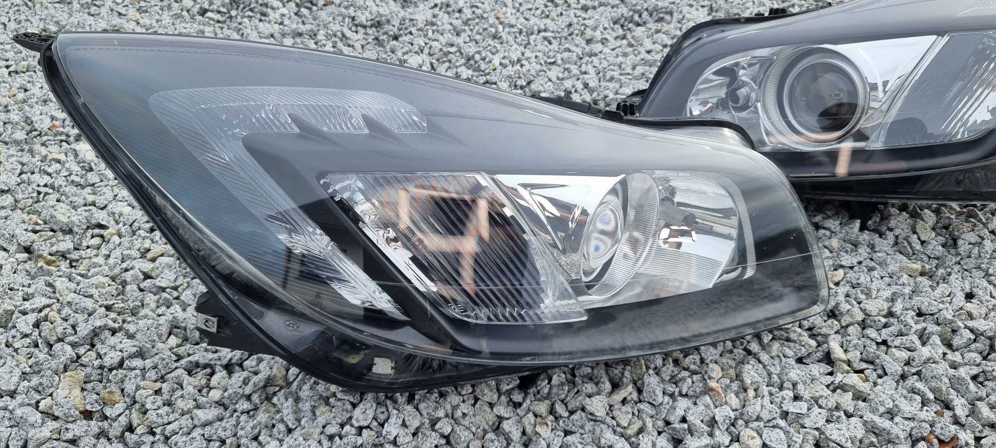 Lampy bi xenon Opel Insignia A skrętne regenerowane reflektory HELLA