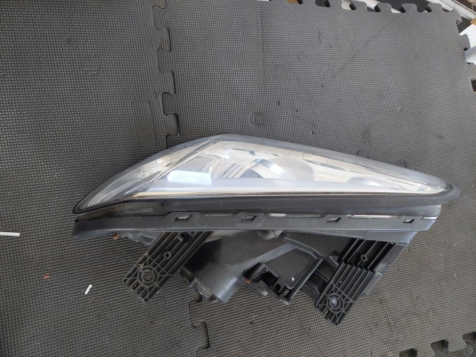 farol esq Chevrolet captiva