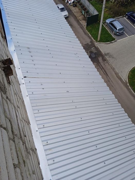 Альпініст, верхолаз,дах висотні роботи,покрівля,бляха