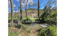 Ruína p/ reconstruir Arganil junto rio