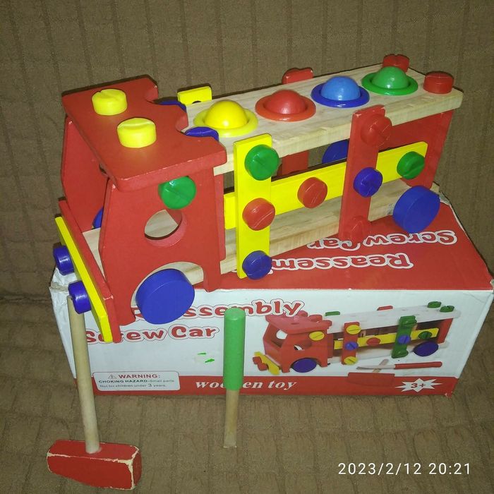 Дере'яна іграшка (машинка) стучалка 2 в 1