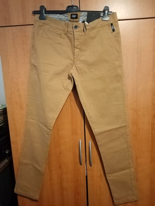 Homem - calças de marca