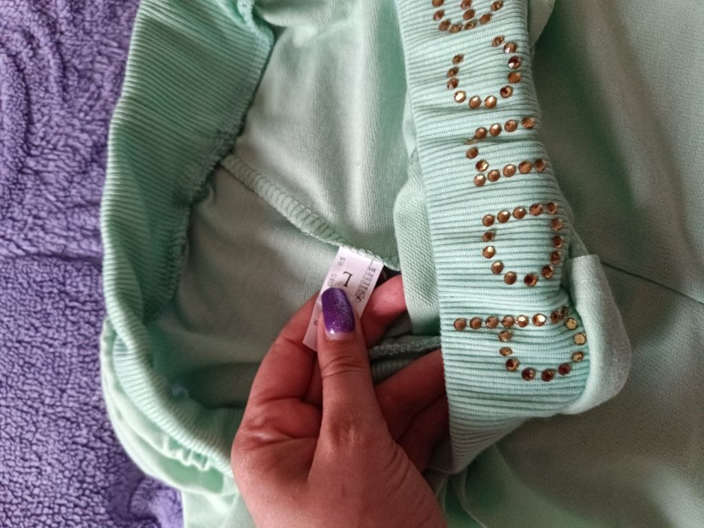 Miętowe spodnie 3/4 nowe L