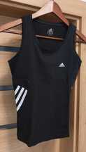 Damski T-shirt marki Adidas w stylu vintage, bez rękawów.