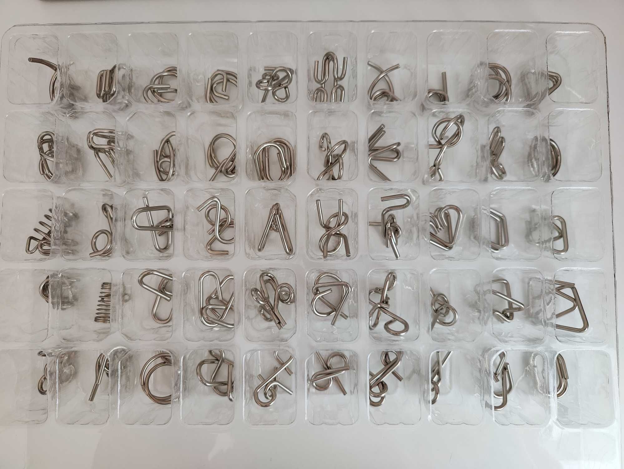 Łamigłówki logiczne, metalowe puzzle, zestaw 50 sztuk
