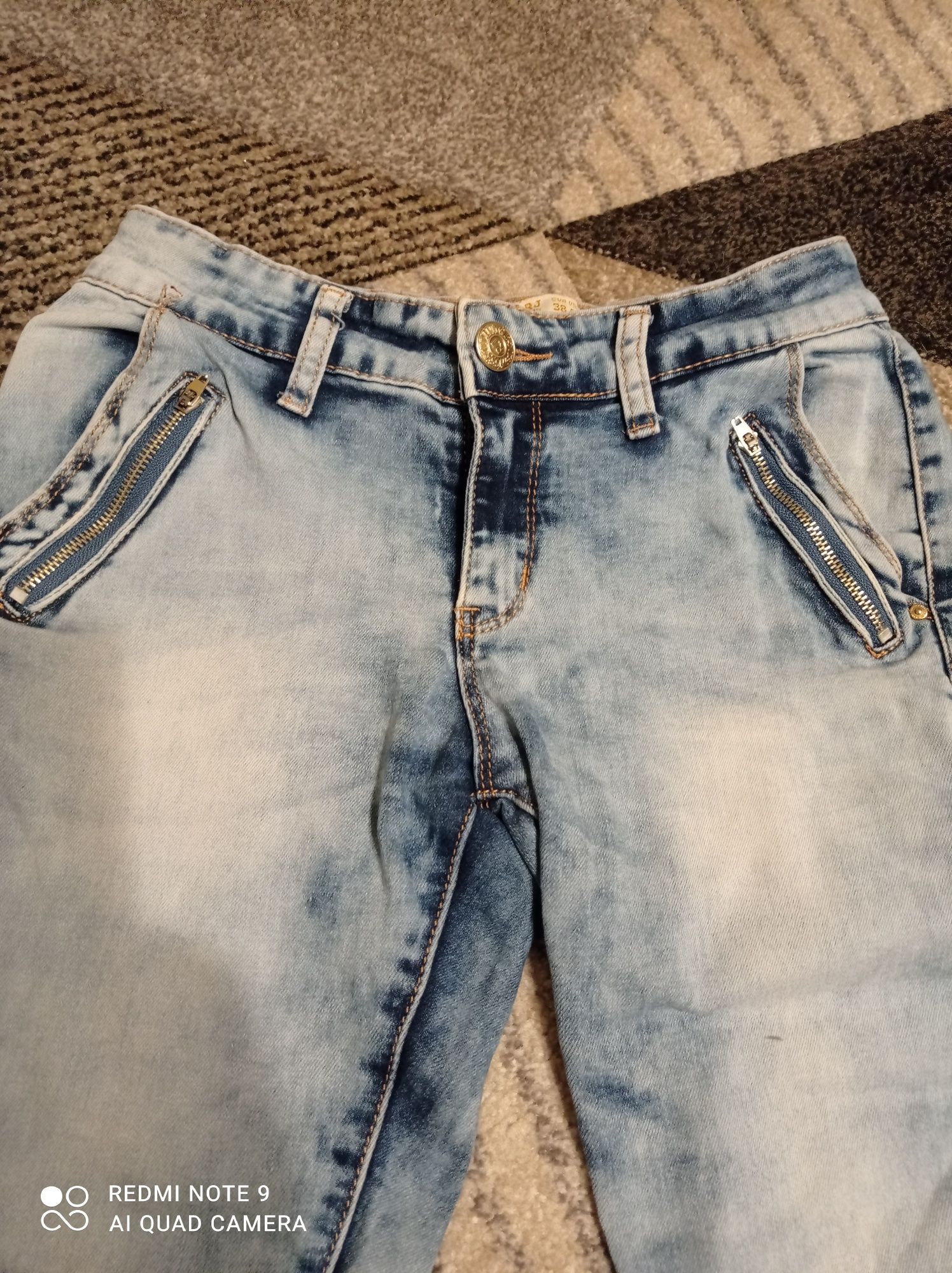 Spodnie jeans 38