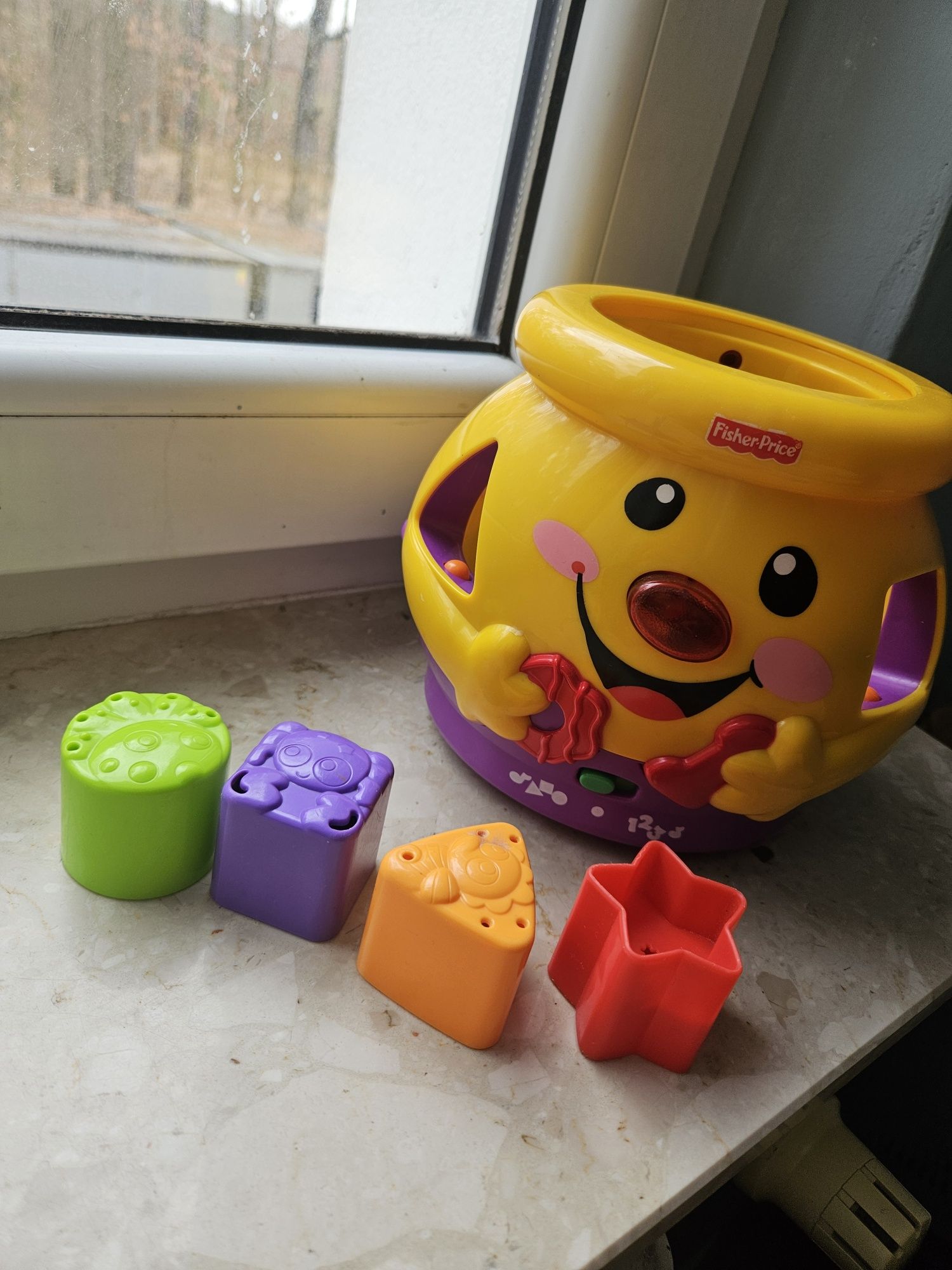 Grający garnuszek od Fisher price