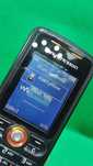 Telefon komórkowy Sony Ericsson w200i Walkman Handy z ładowarką