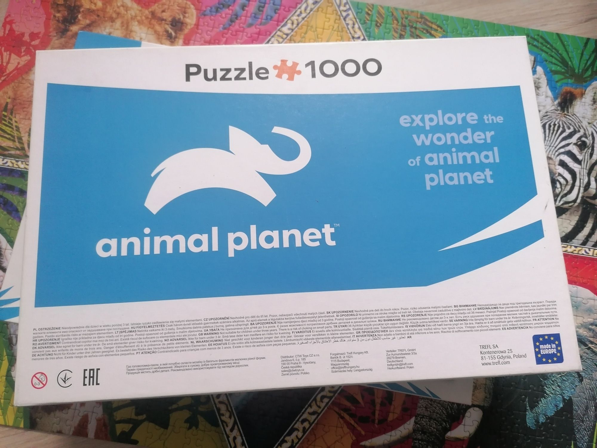 Puzzle 1000 Animal Planet Trefl zwierzęta zebry papuga lew słoń