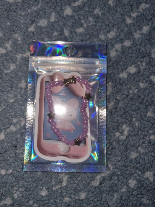 Fioletowa bransoletka z złotymi gwiazdami