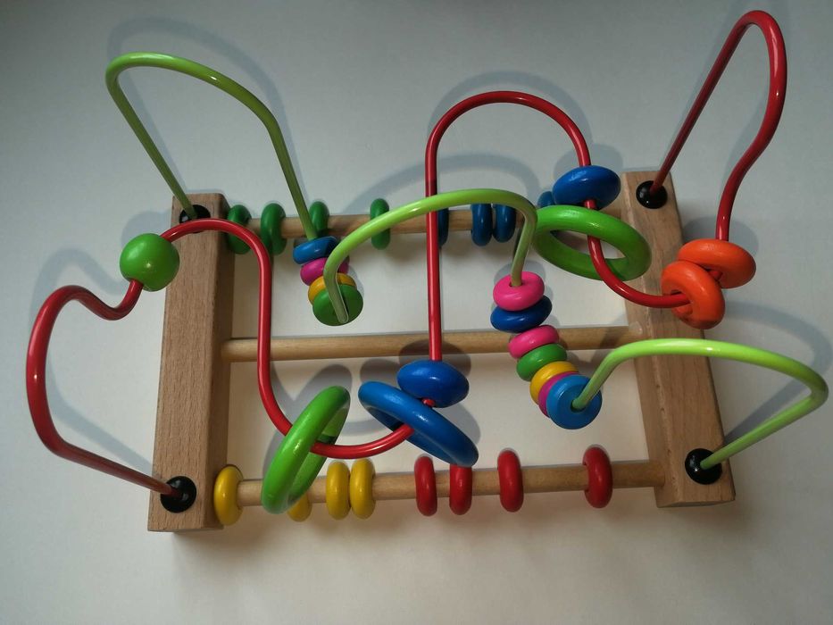 Розвиваюча іграшка каталка з лабіринтом