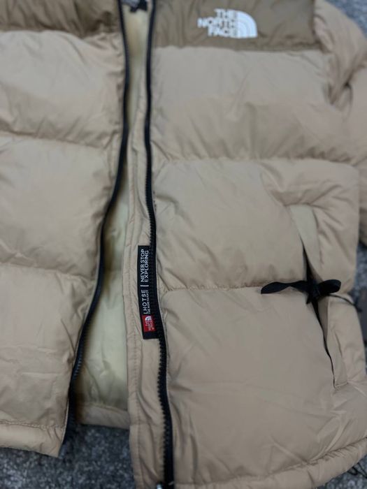 Пуховик бежевий TNF