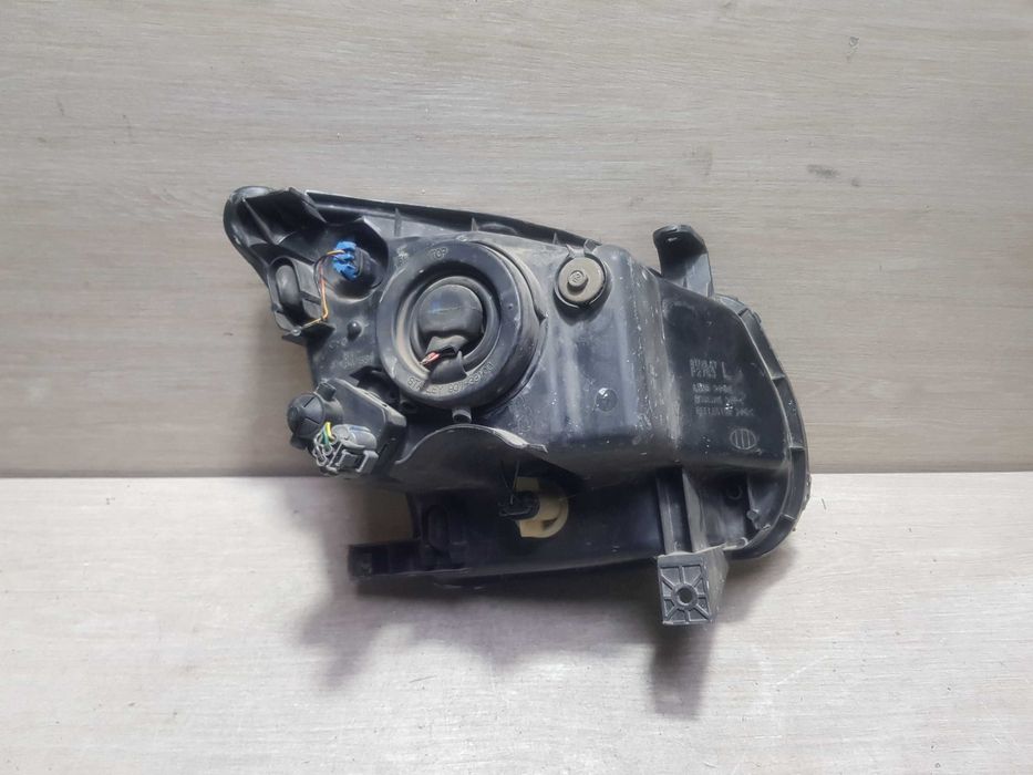 Фара ліва Suzuki Ignis 2003-2008p.