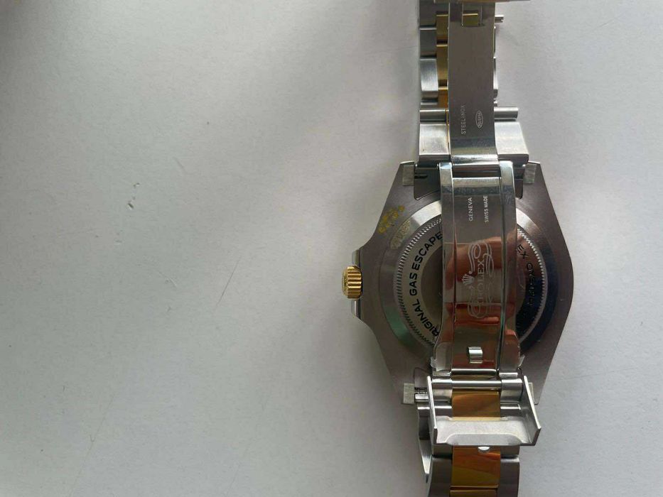 Zegarek Rolex czarno-złoty, stan doskonały