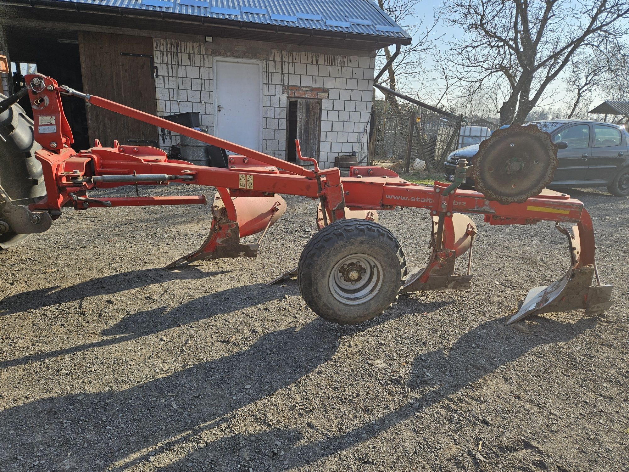 Pacomat pakomat do pługa obrotowego/zagonowego. Pług 4 skibowy