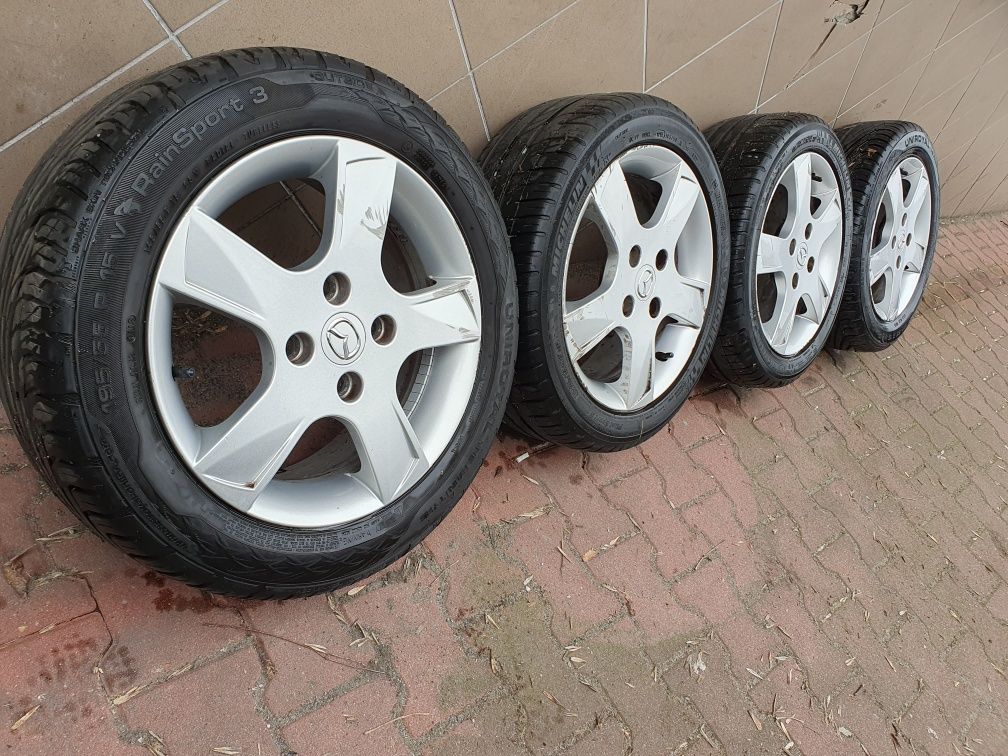 Oryginalne Felgi 15" Mazda 2 Ford 4x108 ET52.5 + 195.55.15 Letnie