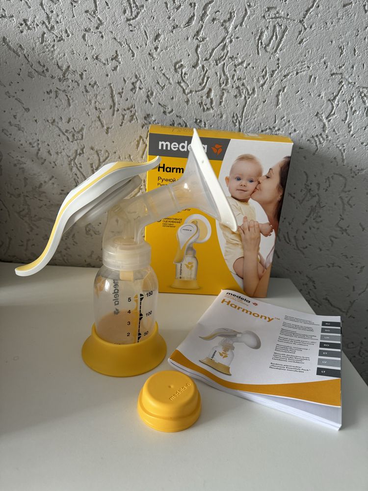 Молокосос Medela ручний + пакети для молока