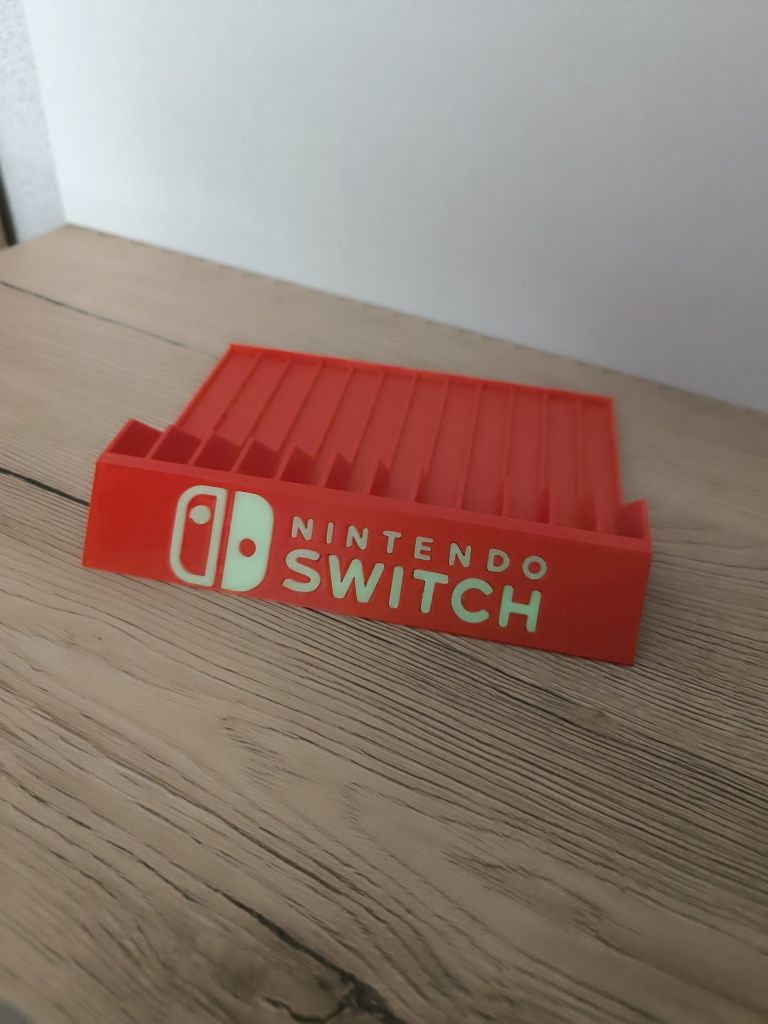 Stojak podstawka na gry Nintendo Switch napisy fluorescencyjne