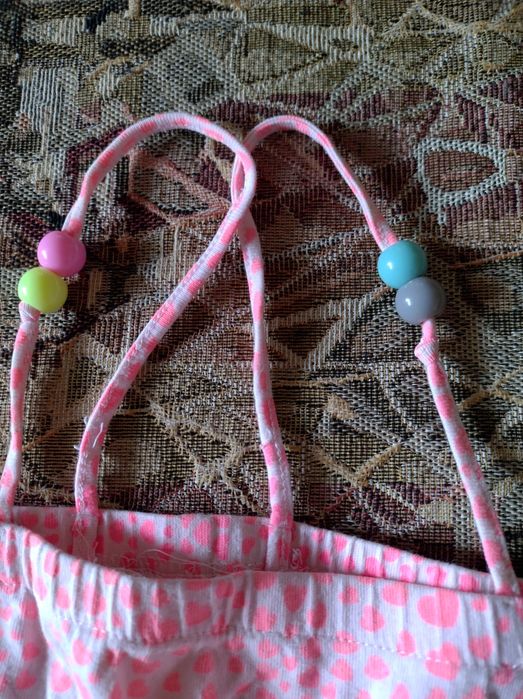 Неоново-рожевий дитячий комбінезон H&M із сердечками