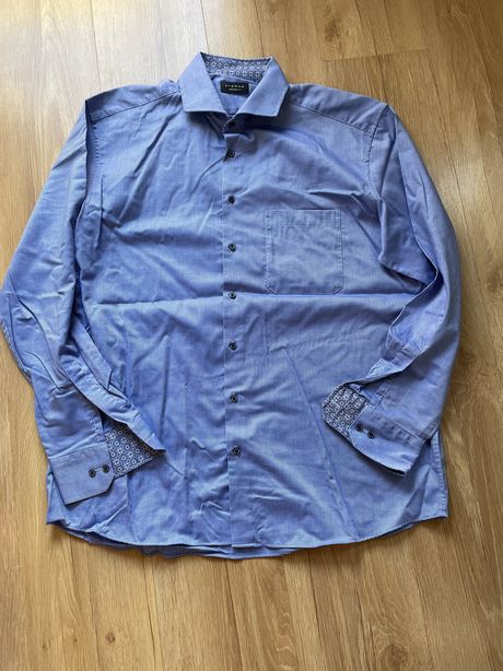 Niebieska koszula z dlugim rękawami z mankietami we wzór Eterna 43