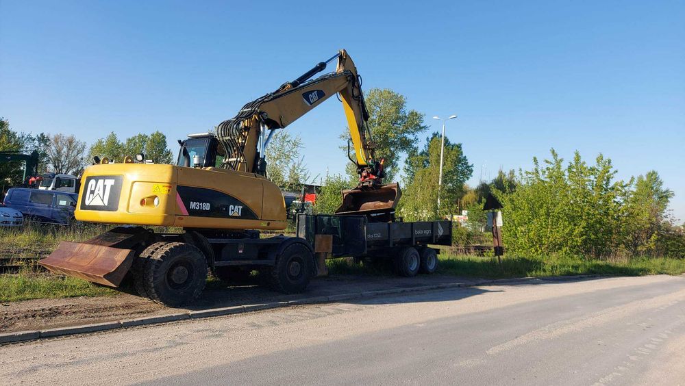 Wynajem koparki kołowej CAT m318d 18ton 20ton z rototilt bez operatora