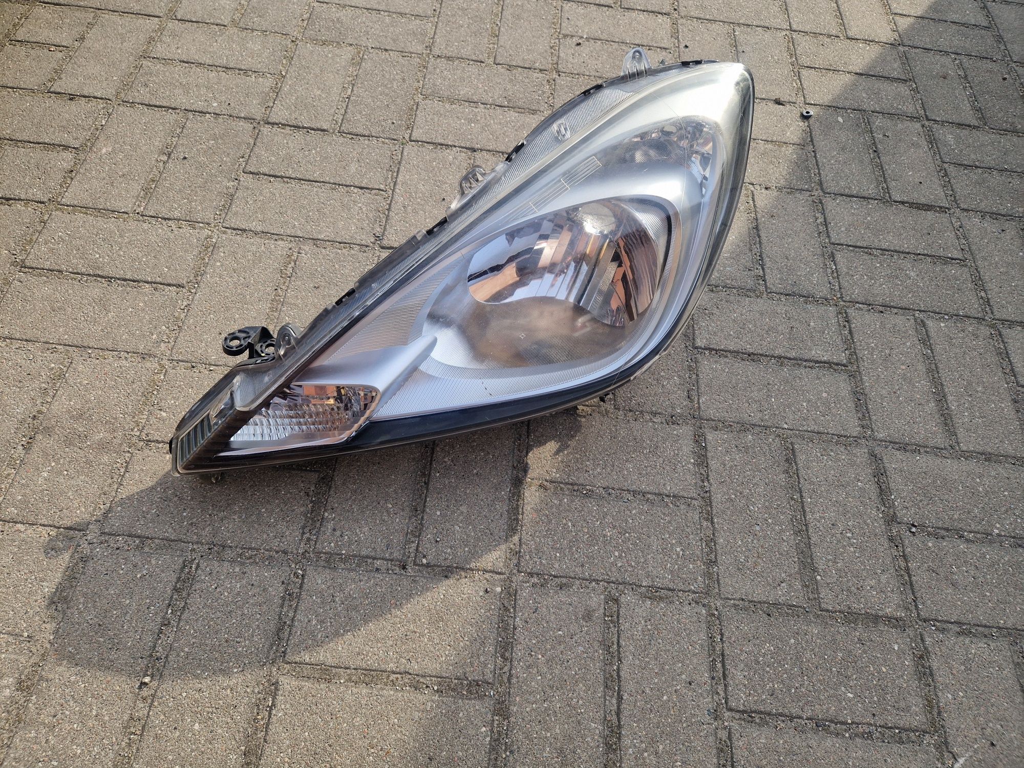 Reflektor Lewy Honda Jazz III lift 2013r