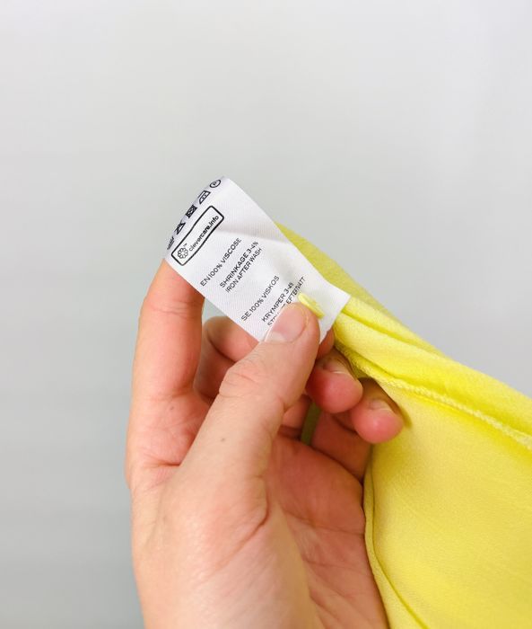 Cytrynowa bluzka z transparentnego materiału i szerokimi rękawami L 40