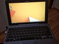 Laptop z dotykowym monitorem i odłączaną klawiaturą. Nie tablet